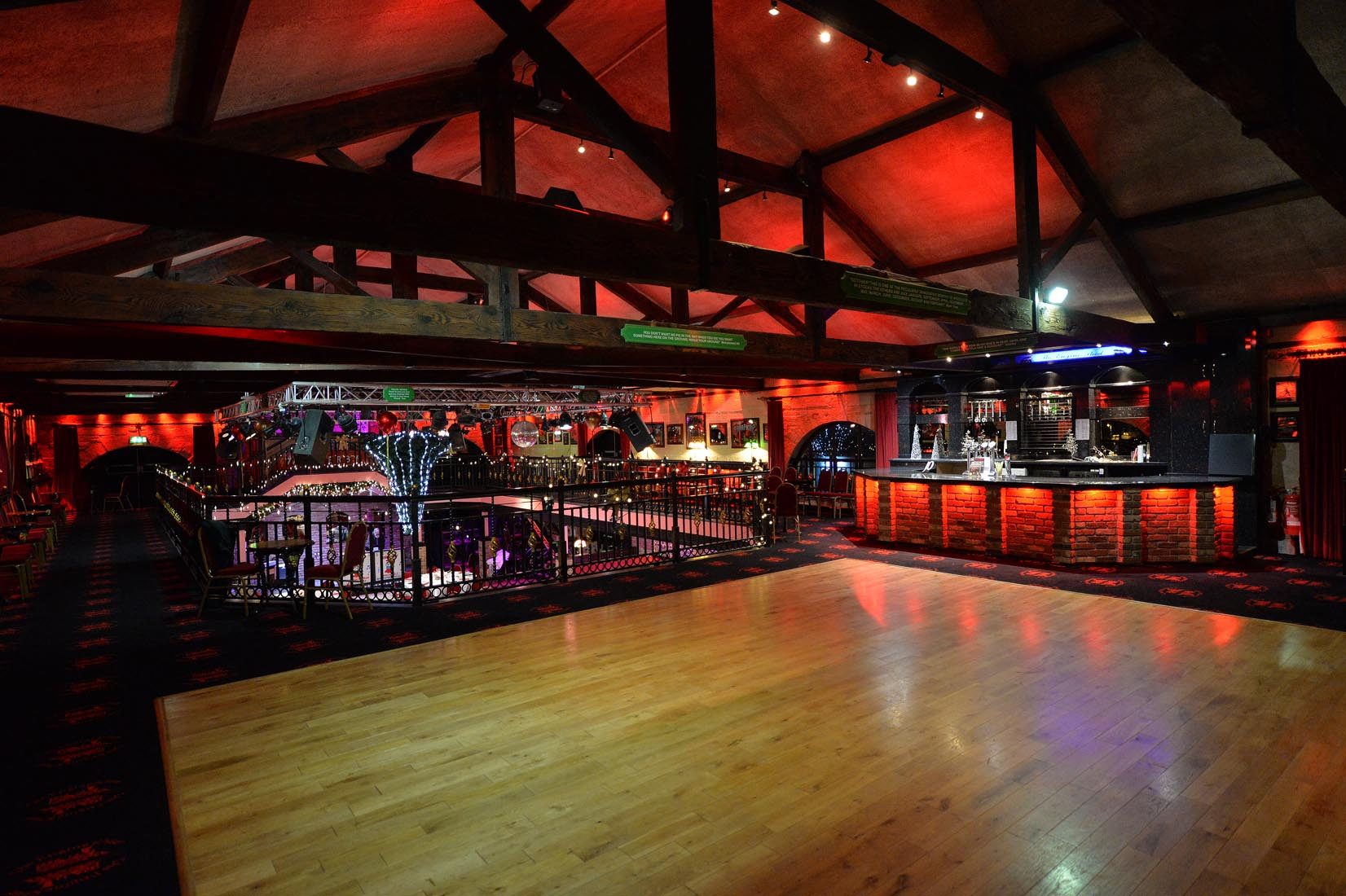 The mezzanine floor with its own bar and dance floor, looking over the room below